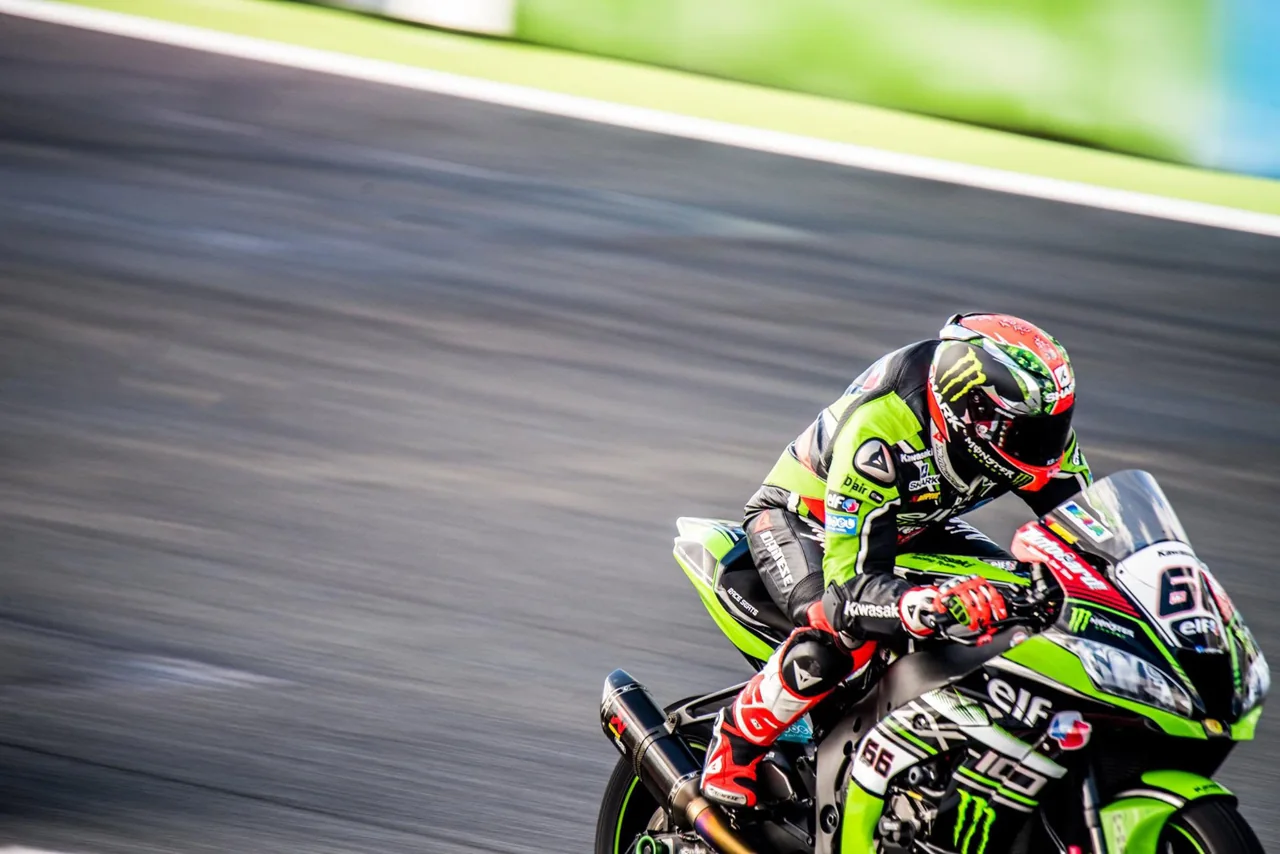 Racers and helmets fill a close view with a softly blurred background.